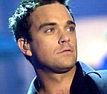 Robbie Williams Holds Bedside Vigil For Ill Mother