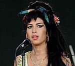 Amy Winehouse Accused Of 'Punching' Fan Outside Home